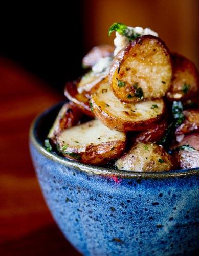 Roast potatoes in a blue bowl