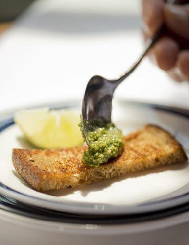 Toast with spoonful of pesto