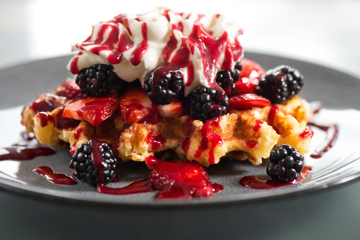 Waffle dessert with blackberries and strawberries