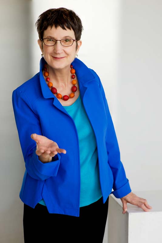 Professional business portrait of a woman business coach gesturing