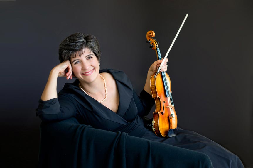 Professional business portrait of a woman violinist, formal, landscape, dark plain background